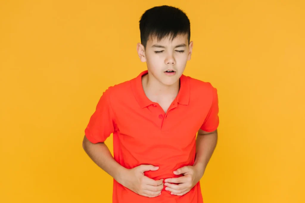 Medium-shot-little-boy-having-stomachache