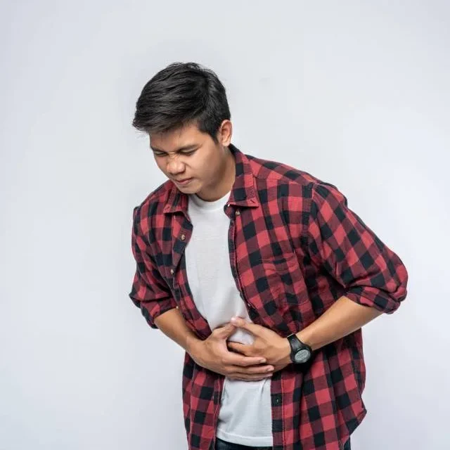 man-stands-with-stomachache-puts-his-hand-his-stomach-scaled-poehaiocjzdbs42akafslu2oz50hfb8kmtdd3gdloy